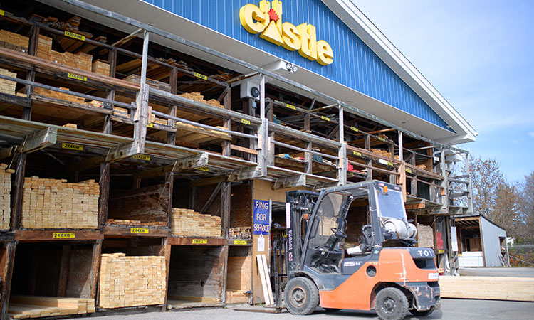 Knowles Building Centre lumberyard with forklift and team member